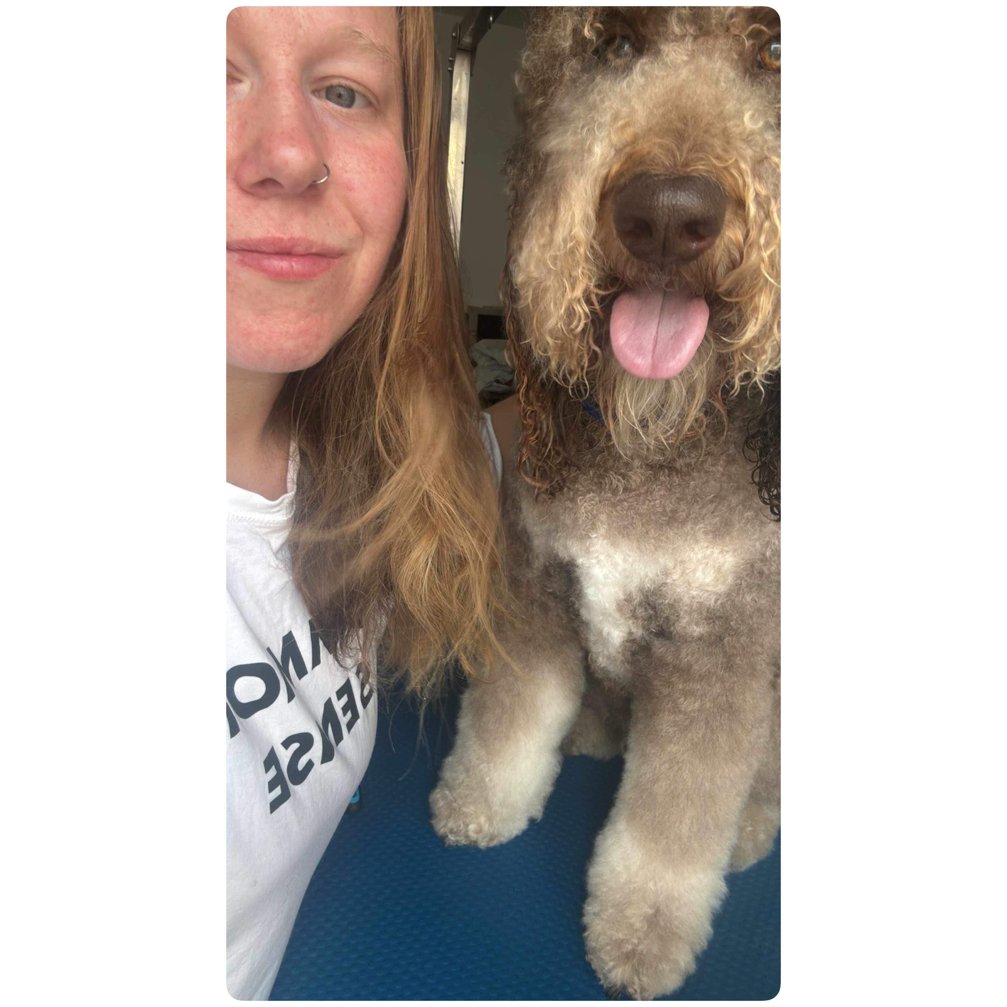 Olivia with a dog at Paws to Perfection