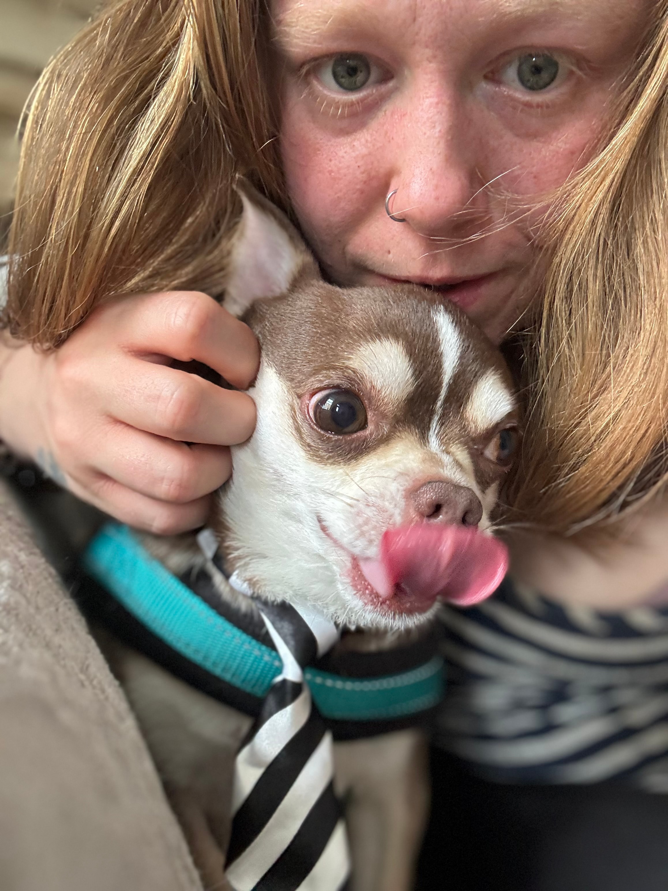 Olivia with a dog at Paws to Perfection