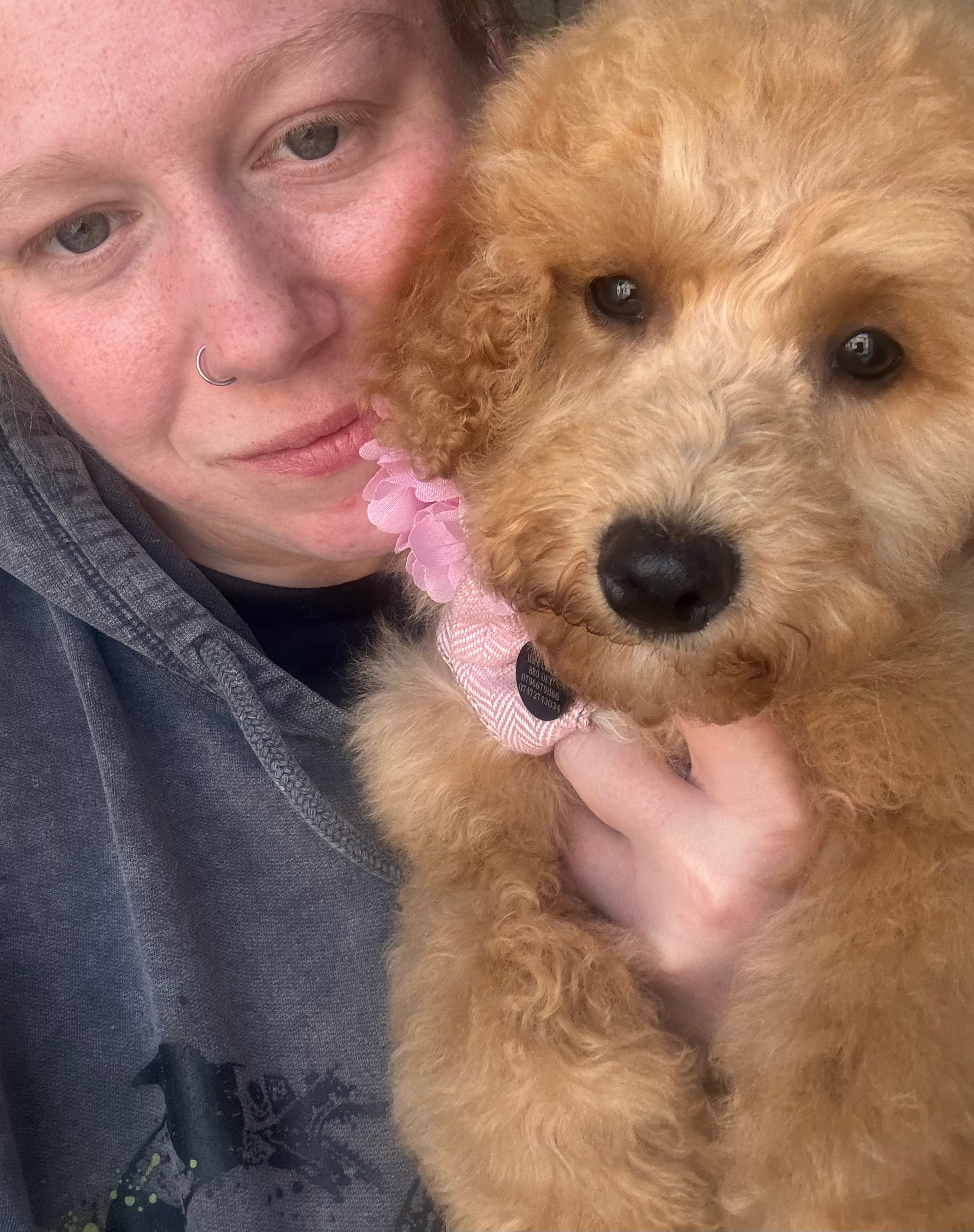 Olivia with a dog at Paws to Perfection