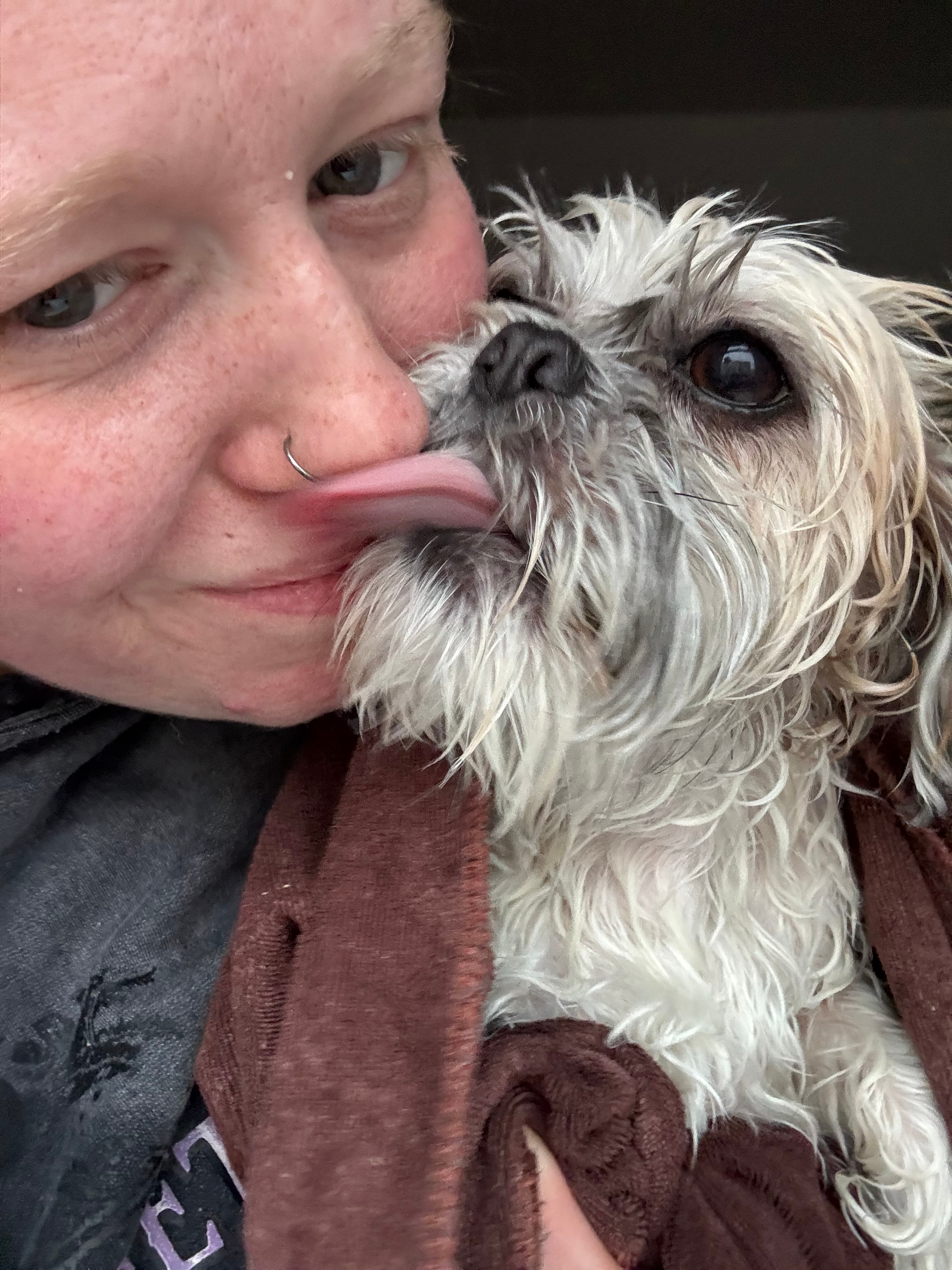 Olivia with a dog at Paws to Perfection