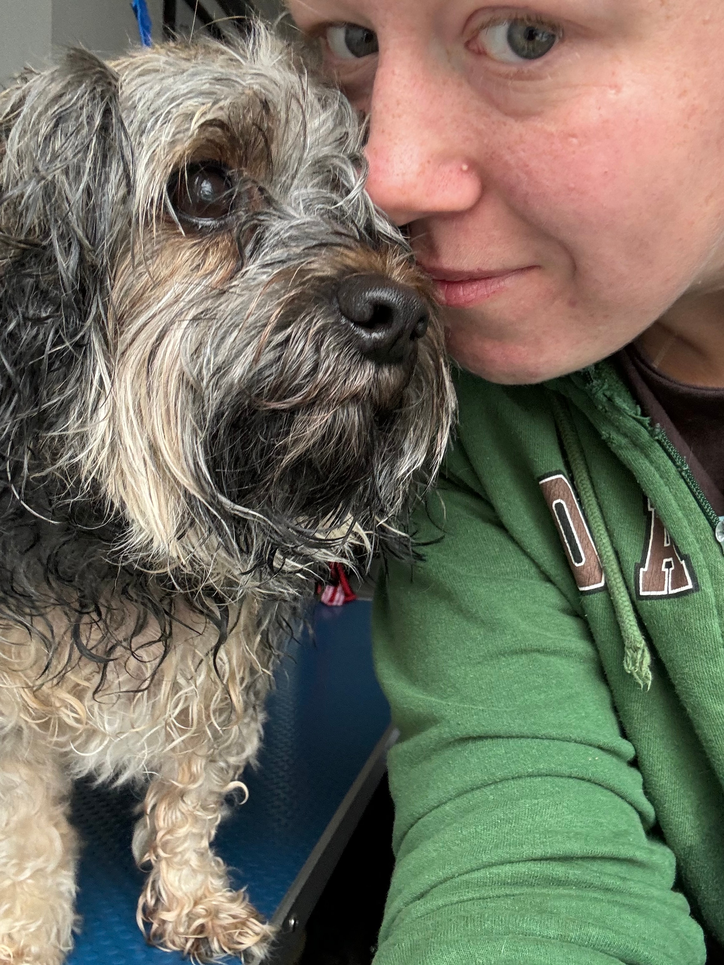 Olivia with a dog at Paws to Perfection